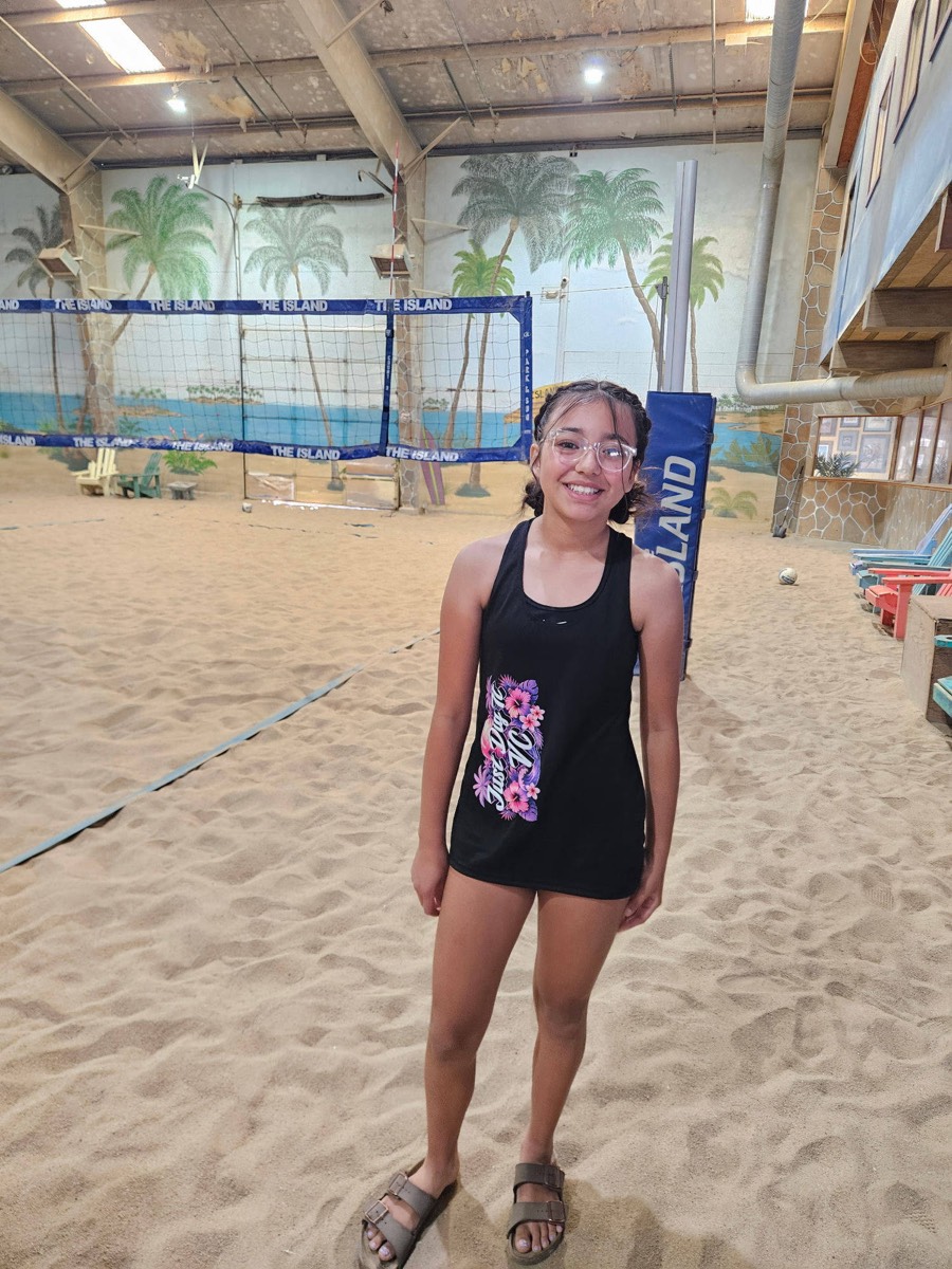 Just Dig It VC beach player smiling at The Island courts