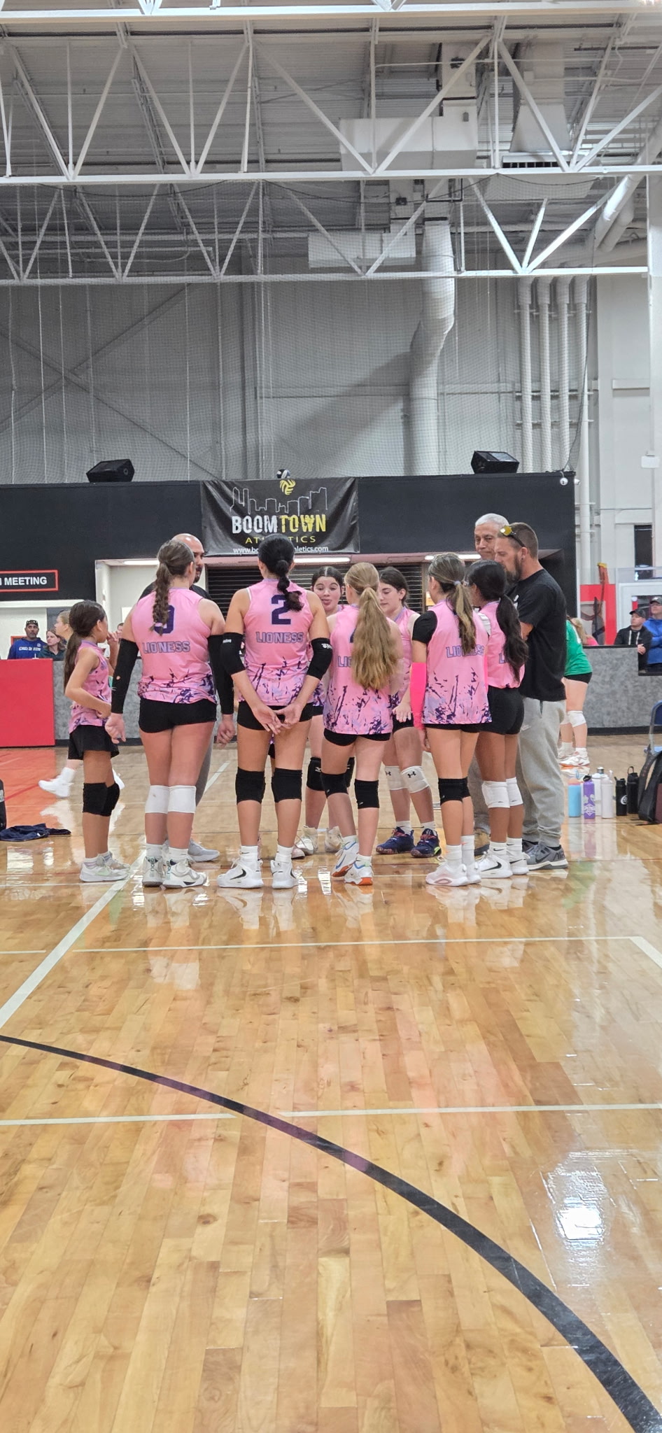 Just Dig It volleyball club players on the court